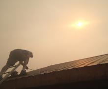 Fixing roof under smoky skies